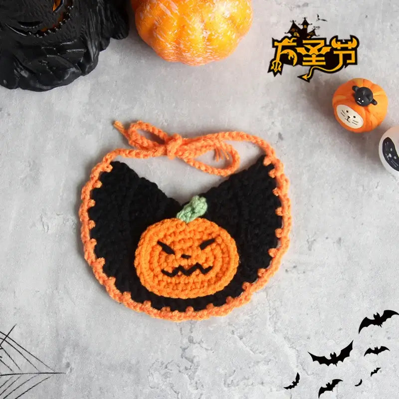 Hand-knit Halloween pet collar bib featuring ghost designs, perfect for dressing up cats and dogs during the spooky season.