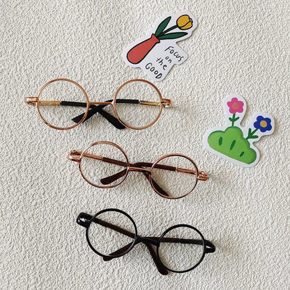 Small dog wearing round wizard cosplay glasses inspired by Harry Potter