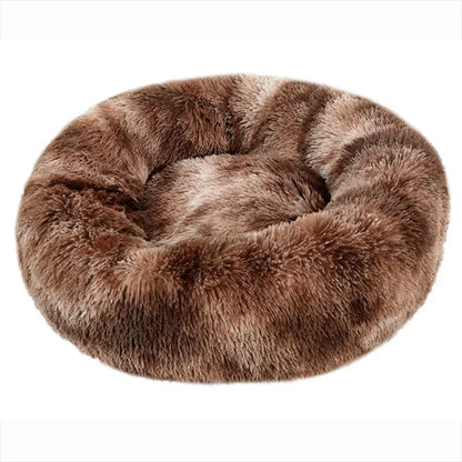 Ultra-soft round plush pet bed for cats and dogs, winter-ready with long plush fabric and non-slip base, available in sizes from 40cm to 90cm.