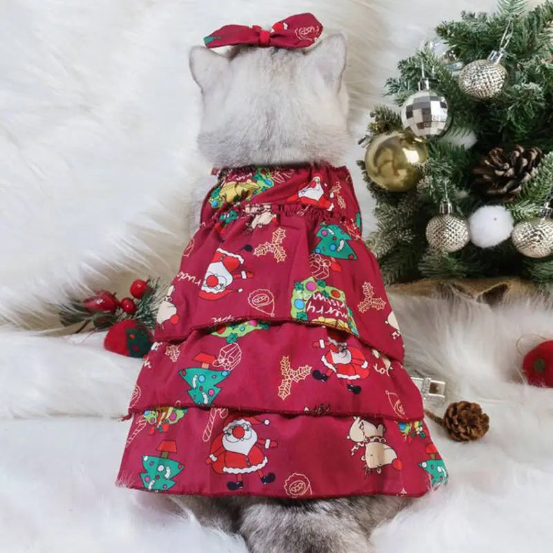 Cat wearing a flannel Christmas hoodie featuring Santa Claus and elk designs, perfect for holiday celebrations.