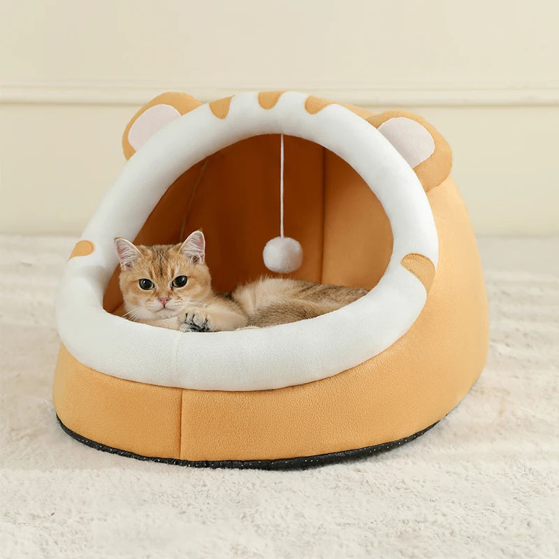 Super cat bed with cave design and plush cushion, providing warmth and comfort for cats during winter.