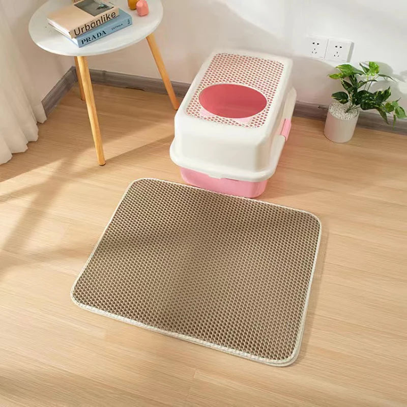 Double layer EVA cat litter mat with waterproof bottom, non-slip surface, and hexagonal holes for litter capture, ideal for maintaining a clean pet area.