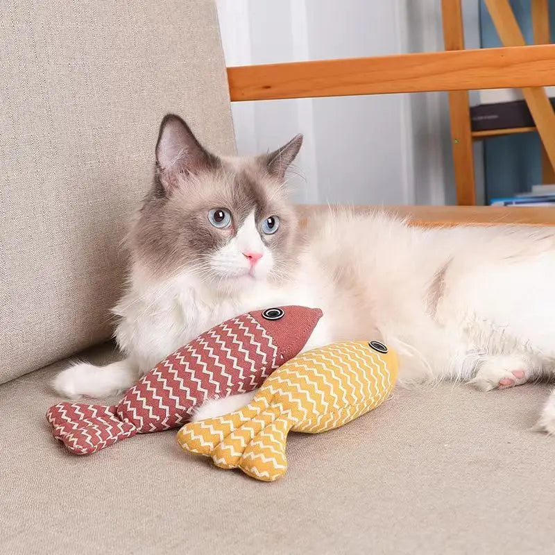 Teeth grinding catnip fish toy for cats, plush and interactive with vocal features to enhance playtime and promote dental health.