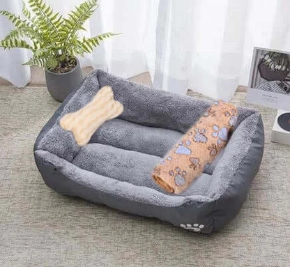Bone-shaped soft cotton dog bed, washable and breathable with warm padding, designed for year-round comfort and suitable for dogs of all sizes.