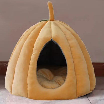 Pumpkin-shaped enclosed cat bed for winter warmth and Halloween decor.
