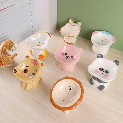 Cute ceramic cartoon pet bowl elevated for cats and small dogs.