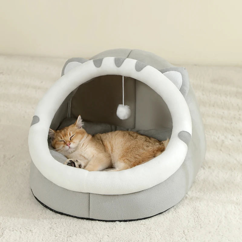 Super cat bed with cave design and plush cushion, providing warmth and comfort for cats during winter.