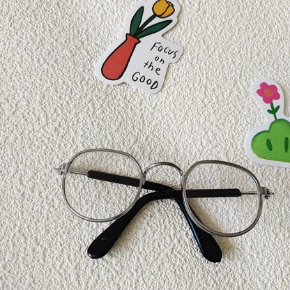 Small dog wearing round wizard cosplay glasses inspired by Harry Potter