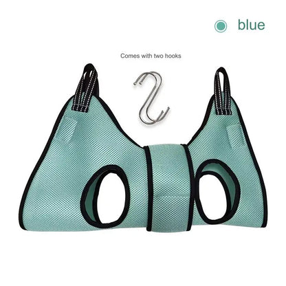 Cat suspended in a grooming hammock while getting its nails trimmed, safe and stress-free grooming tool