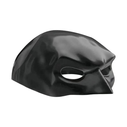 Cat wearing a black bat-inspired superhero mask, posing confidently for Halloween.