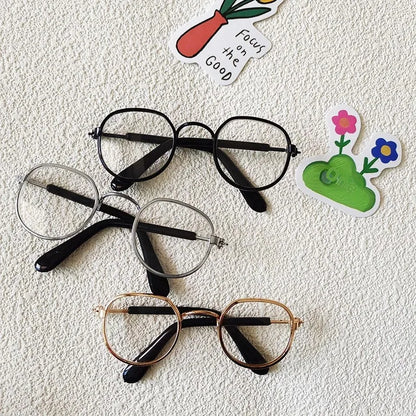 Small dog wearing round wizard cosplay glasses inspired by Harry Potter