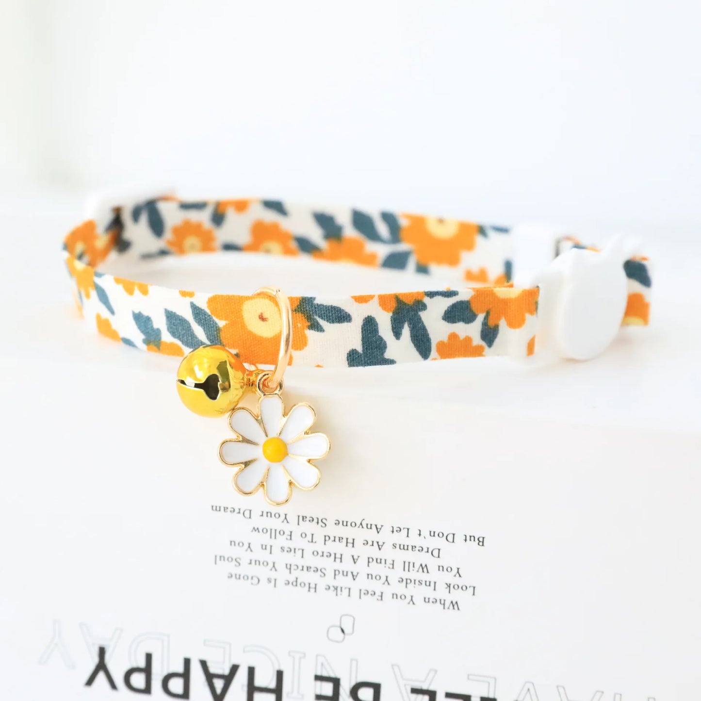 Plaid bow cat collar with daisy charm, safety buckle, and reflective design for small dogs and cats