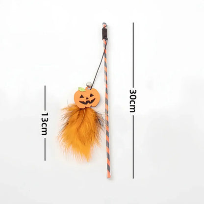 Halloween-themed cat teaser wand with pumpkin, ghost, feathers, and bell.
