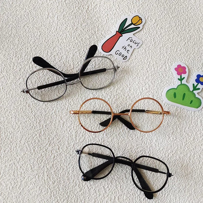 Small dog wearing round wizard cosplay glasses inspired by Harry Potter