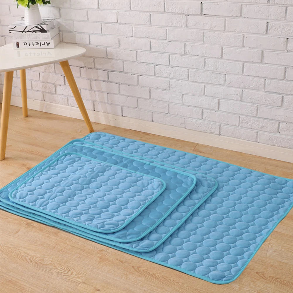 Pet cooling mat in ice silk fabric for summer comfort, suitable for dogs and cats in various sizes.