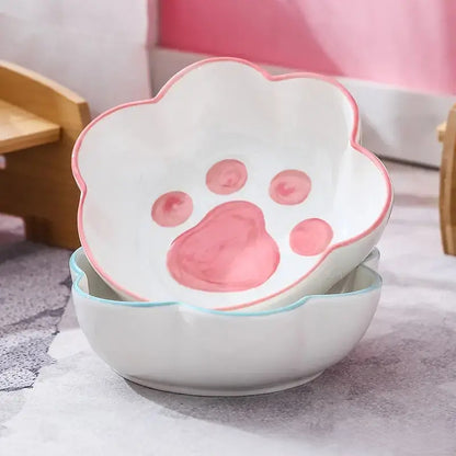 Cat paw-shaped ceramic pet bowl with bamboo stand, perfect for cats and dogs.