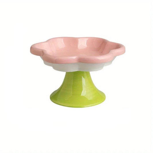 Ceramic raised cat bowl with flower design, ergonomic elevated dish for food and water, ensuring neck protection and comfort during mealtime.