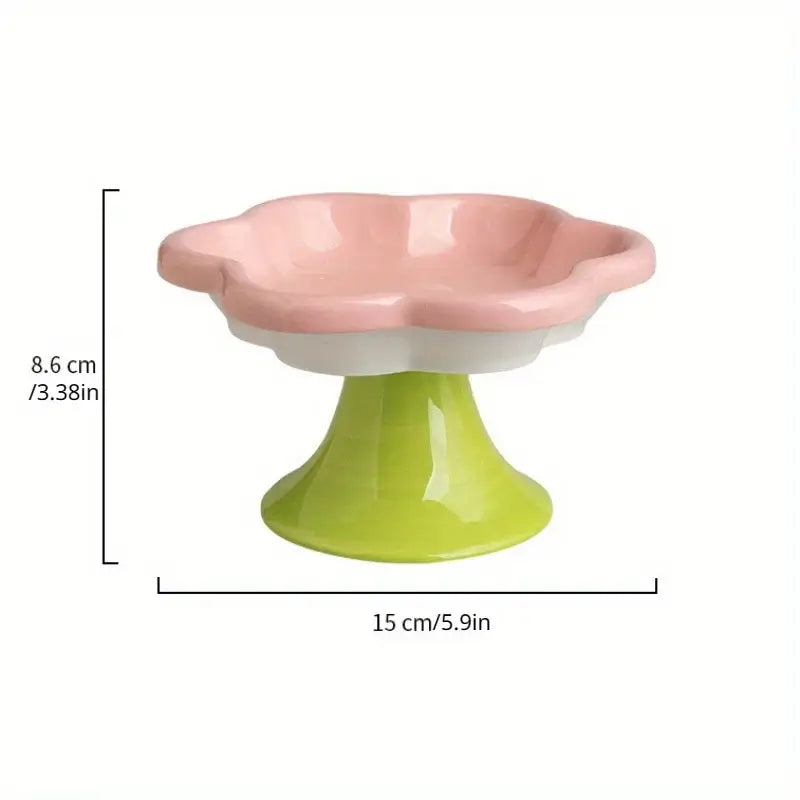 Ceramic raised cat bowl with flower design, ergonomic elevated dish for food and water, ensuring neck protection and comfort during mealtime.