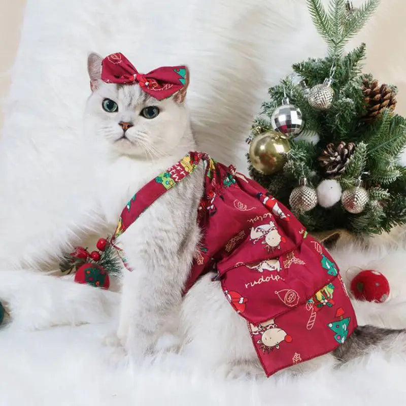 Cat wearing a flannel Christmas hoodie featuring Santa Claus and elk designs, perfect for holiday celebrations.