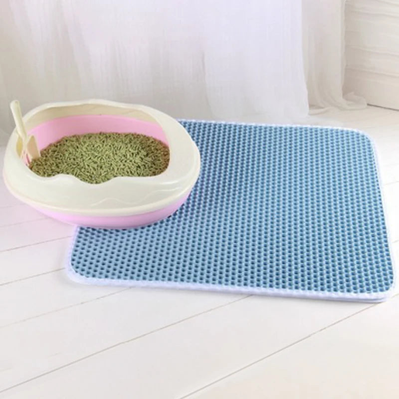 Double layer EVA cat litter mat with waterproof bottom, non-slip surface, and hexagonal holes for litter capture, ideal for maintaining a clean pet area.