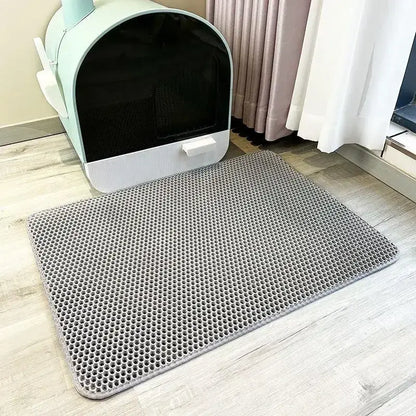 Double-layer waterproof cat litter mat made of soft EVA material for easy litter collection and floor protection.