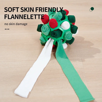 Dog playing with an interactive rubber sniffing ball filled with treats.