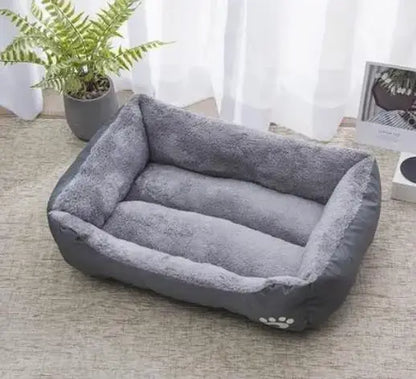 Bone-shaped soft cotton dog bed, washable and breathable with warm padding, designed for year-round comfort and suitable for dogs of all sizes.