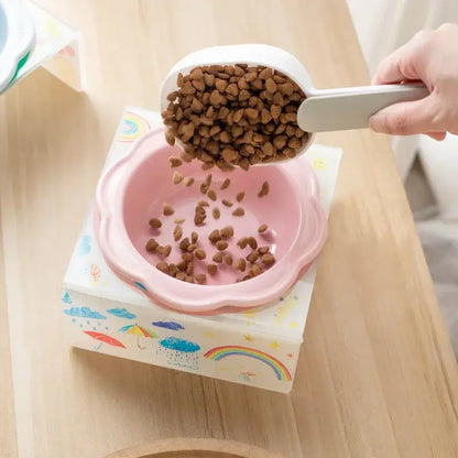 Flower-shaped ceramic pet bowl with clear acrylic stand for cats and dogs.