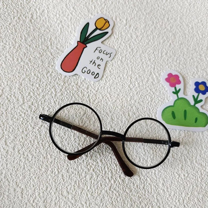 Small dog wearing round wizard cosplay glasses inspired by Harry Potter