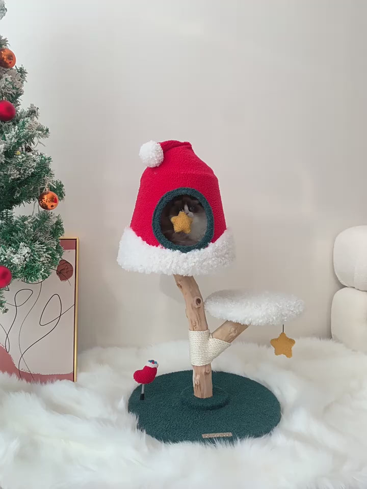 Festive Christmas tree cat tree with sisal rope posts, platforms, and a cozy cat house for climbing and scratching.